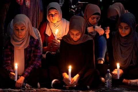 A candlelight prayer is held outside the State Library of Victoria, in Australia, on Saturday, March 16.