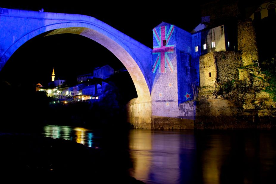 The colors of the New Zealand flag are projected onto the historic Old Bridge over the Neretva River in Mostar, Bosnia-Herzigovina, to commemorate the victims of the deadly mosque attacks in Christchurch.