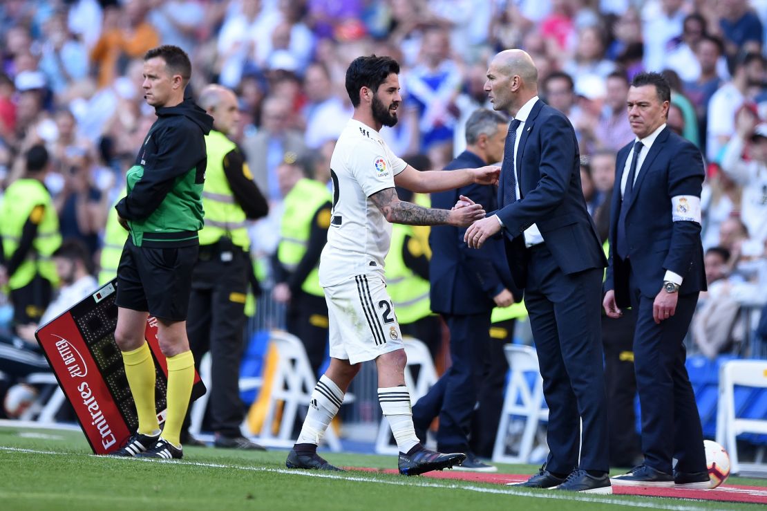 Isco of Real Madrid shakes hands with Zinedine Zidane, back for his second spell in charge.