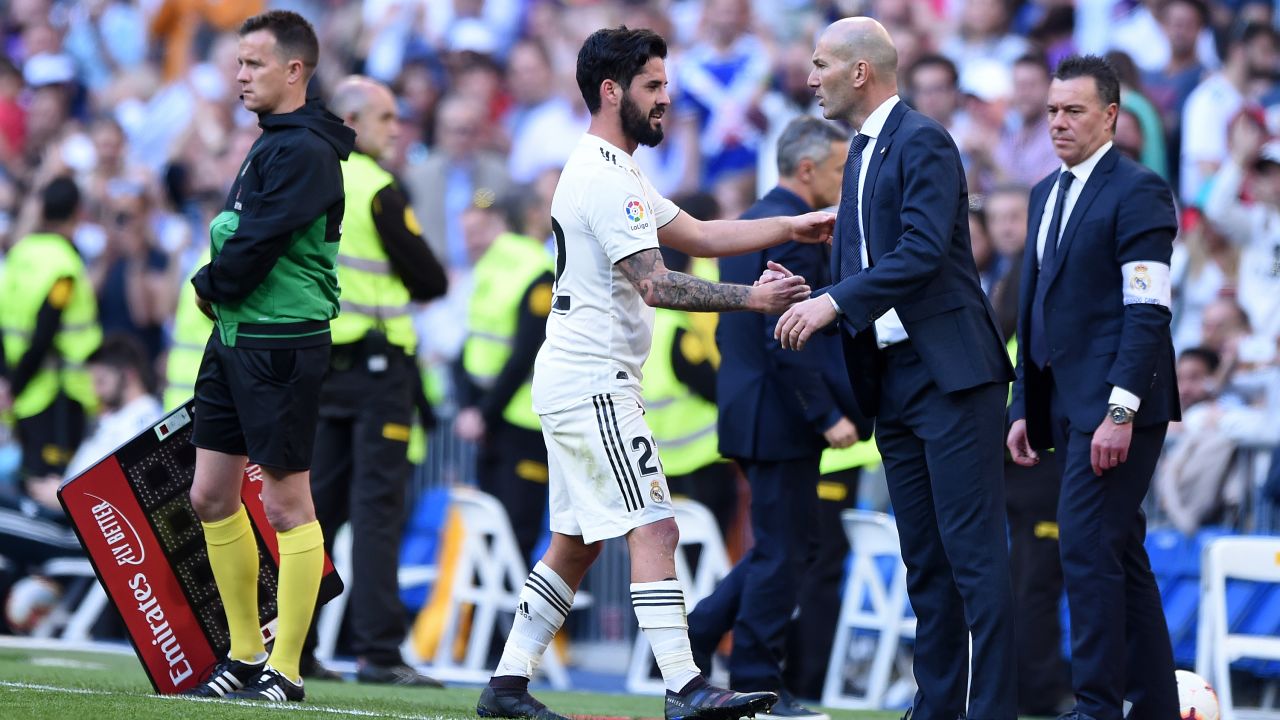 Isco of Real Madrid shakes hands with Zinedine Zidane, back for his second spell in charge.
