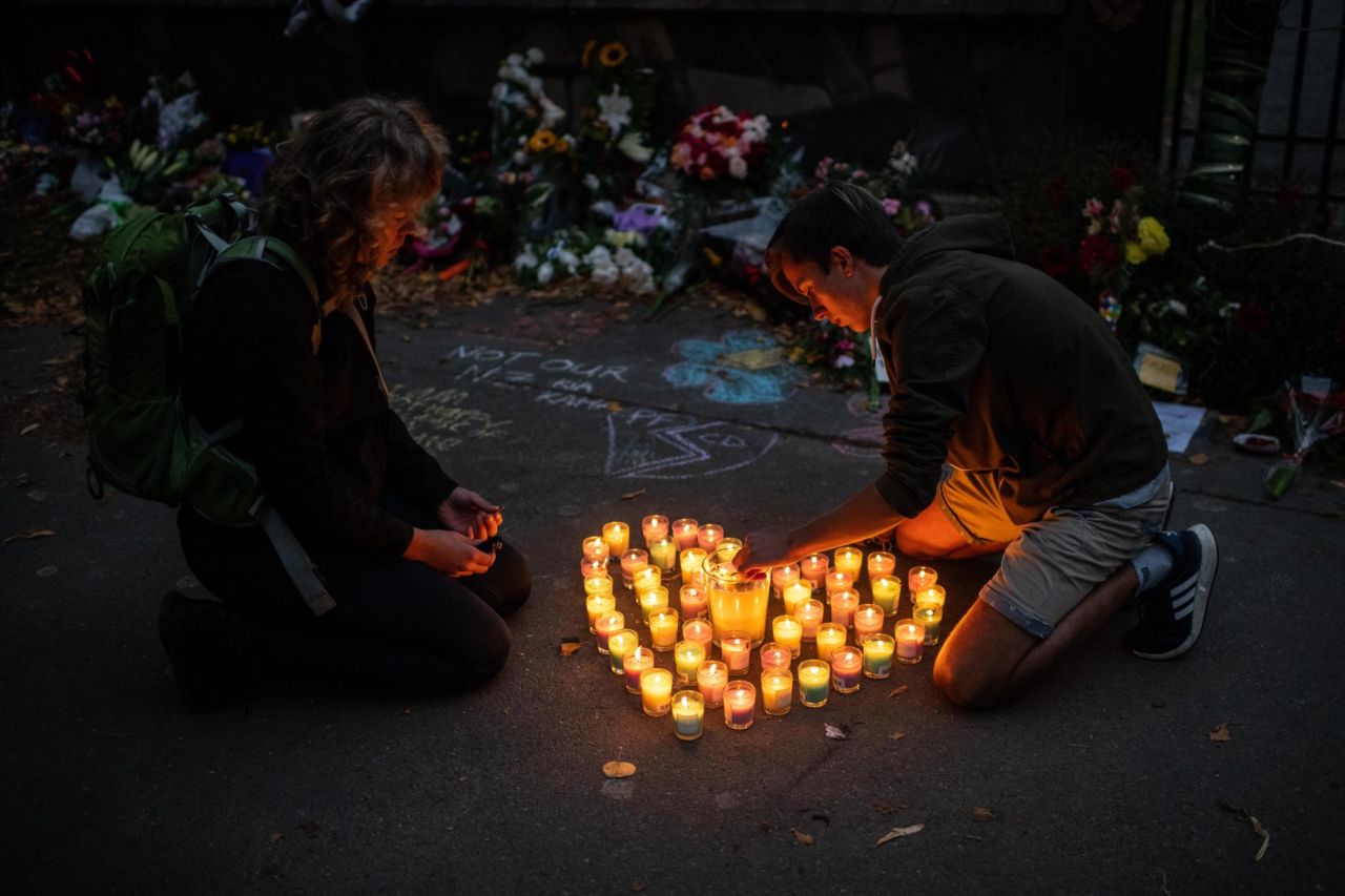 People light candles next to the Botanic Gardens in Christchurch on March 17.