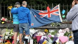 People pay their respects at a memorial outside the Botanical Gardens as a tribute to victims of the mosque attacks in Christchurch on March 17, 2019. At least 50 people were killed and 36 injured in mass shootings at two mosques in the New Zealand city of Christchurch Friday, 15 March. A 28-year-old Australian born, man Brenton Tarrant, appeared in Christchurch District Court on Saturday charged with murder.
 (Photo by Sanka Vidanagama/NurPhoto via Getty Images)