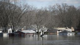 The Rock River crested its banks and flooded Shore Drive on Saturday, March 16 in Machesney Park, Illinois. Many rivers and creeks in the Midwest are at record levels after days of snow and rain. (Scott P. Yates/Rockford Register Star via AP)