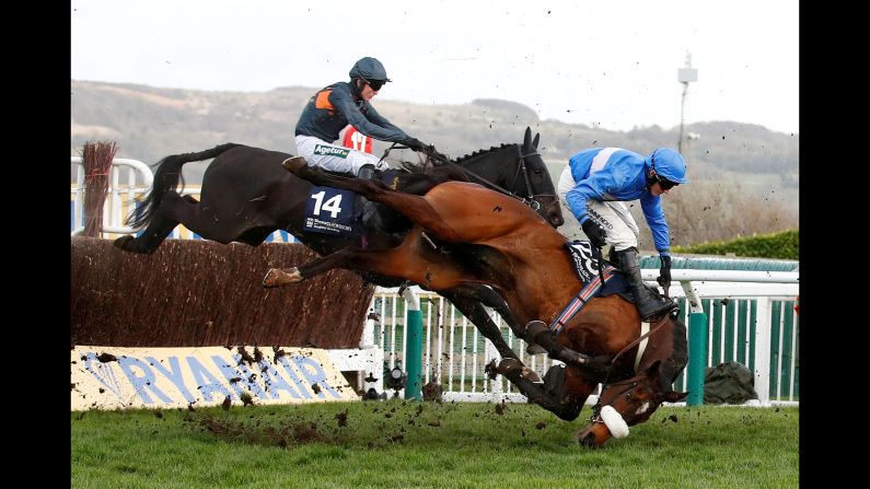 King's Odyssey, ridden by Adam Wedge, falls during the 4.10 Brown Advisory & Merriebelle Stable Plate Handicap Chase in Cheltenham, England, on Thursday, March 14.