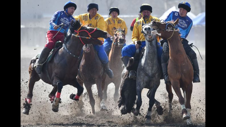 Kyrgyz riders play the traditional Central Asian sport of Kok-Boru (Gray Wolf) or Buzkashi (Goat Grabbing) in Bishkek, Kyrgyzstan, on Saturday, March 16. Mounted players compete for points by throwing a stuffed sheepskin into a well. Games are dedicated to the celebration of Nowruz, "The New Year" in Farsi, an ancient festival marking the first day of spring in Central Asia on March 21.