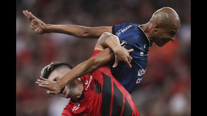 Tomas Andrade, left, of Athletico PR fights with Alex Silva of Jorge Wilstermann at a match during Copa CONMEBOL Libertadores 2019 at Arena da Baixada in Curitiba, Brazil, on Thursday, March 14.