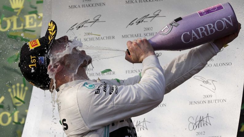Mercedes driver Valtteri Bottas of Finland sprays himself with champagne after winning the Australian Formula 1 Grand Prix in Melbourne on Sunday, March 17.