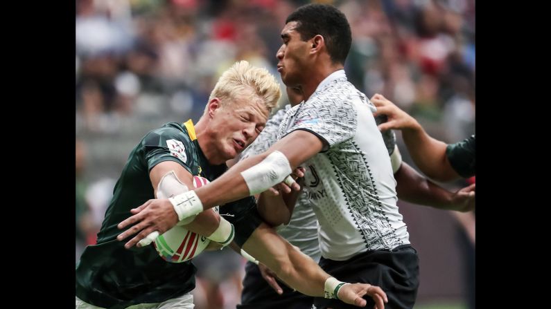 South Africa's JC Pretorius, left, is tackled by Fiji's Meli Derenalagi during World Rugby Sevens Series game action in Vancouver, British Columbia, on Sunday, March 10.