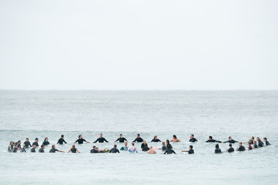 Local surfers and surfers competing in the Sydney Surf Pro participate in a paddle-out, wreath laying and observe a minute of silence to remember victims of the Christchurch mosque attacks at Manly Beach on March 17 in Sydney, Australia.