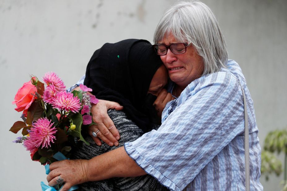 Women embrace near Masjid Al Noor mosque in Christchurch, New Zealand, on March 17.