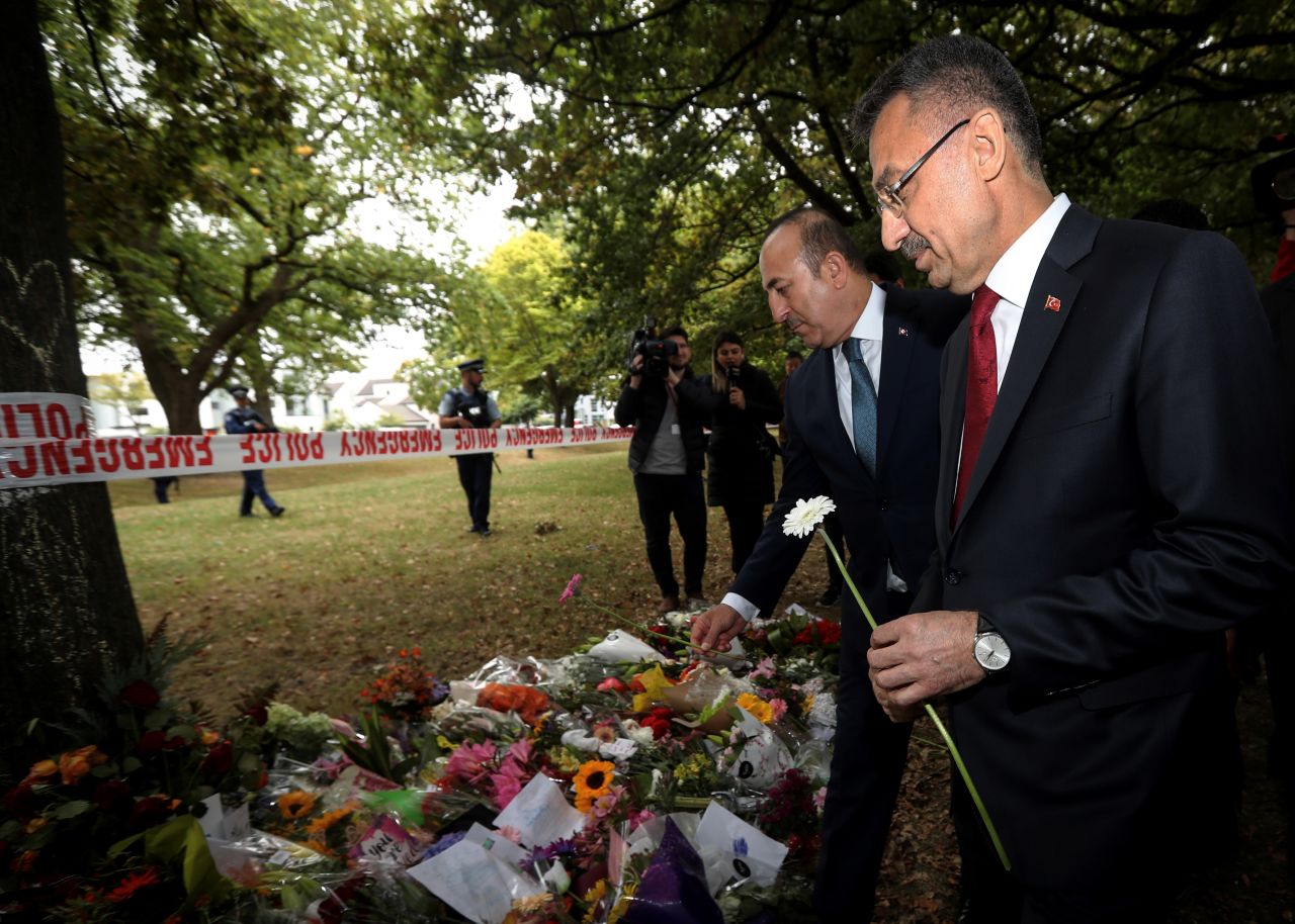 Vice President of Turkey, Fuat Oktay (right), and Minister of Foreign Affairs of Turkey, Mevlut Cavusoglu, lay flowers during their March 18 visit to Al Noor mosque, which was targeted in Friday's twin terror attacks in Christchurch, New Zealand.