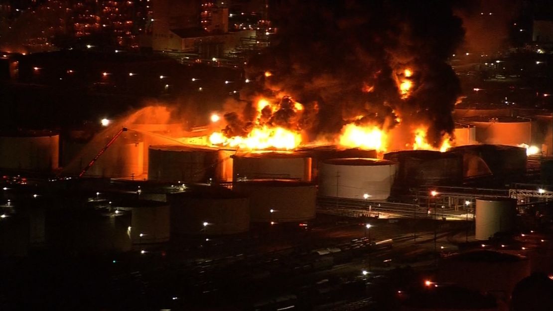 The fire ignited tanks containing gas, oil, naphtha, xylene and toluene, officials say. 