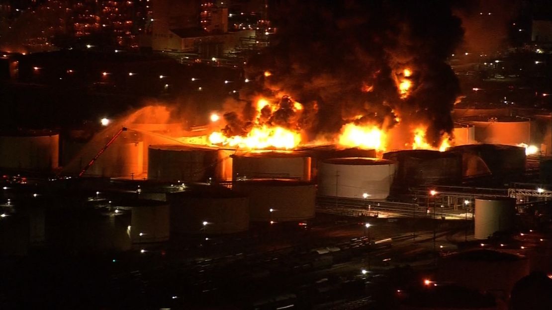 The fire ignited tanks containing gas, oil, naphtha, xylene and toluene, officials say.