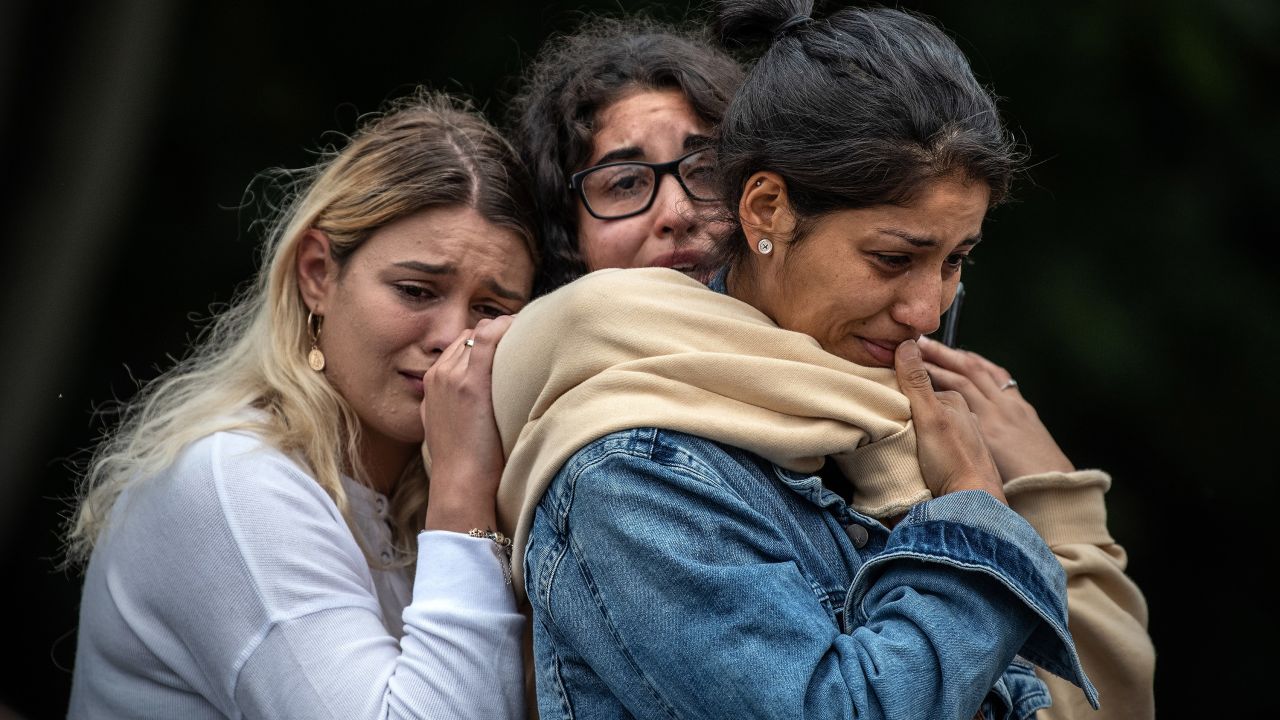 Women weep as they comfort each other during a vigil near the Masjid Al Noor mosque in Christchurch, New Zealand, on Monday, March 18.