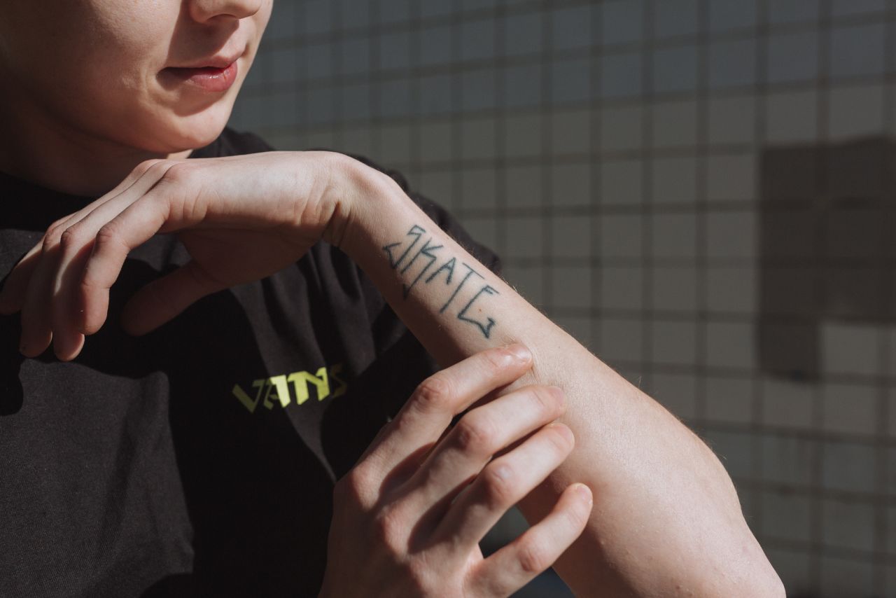 Westling shows a tattoo on his arm that says "Skate."