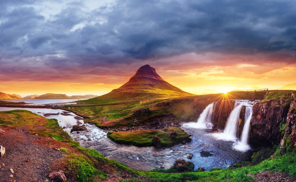 <strong>4. Iceland. </strong>Fourth place Iceland offers hot springs and stunning waterfalls, like this one at Kirkjufell mountain, that appear otherworldly.
