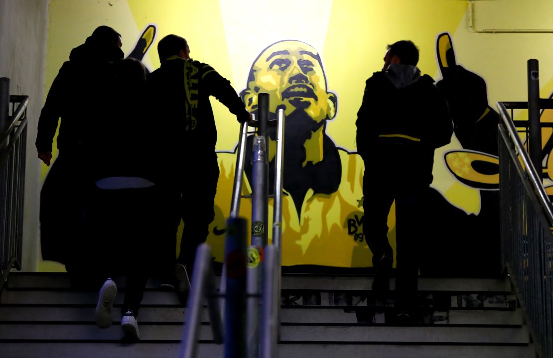 Fans arrive at Dortmund's stadium ahead of a match.