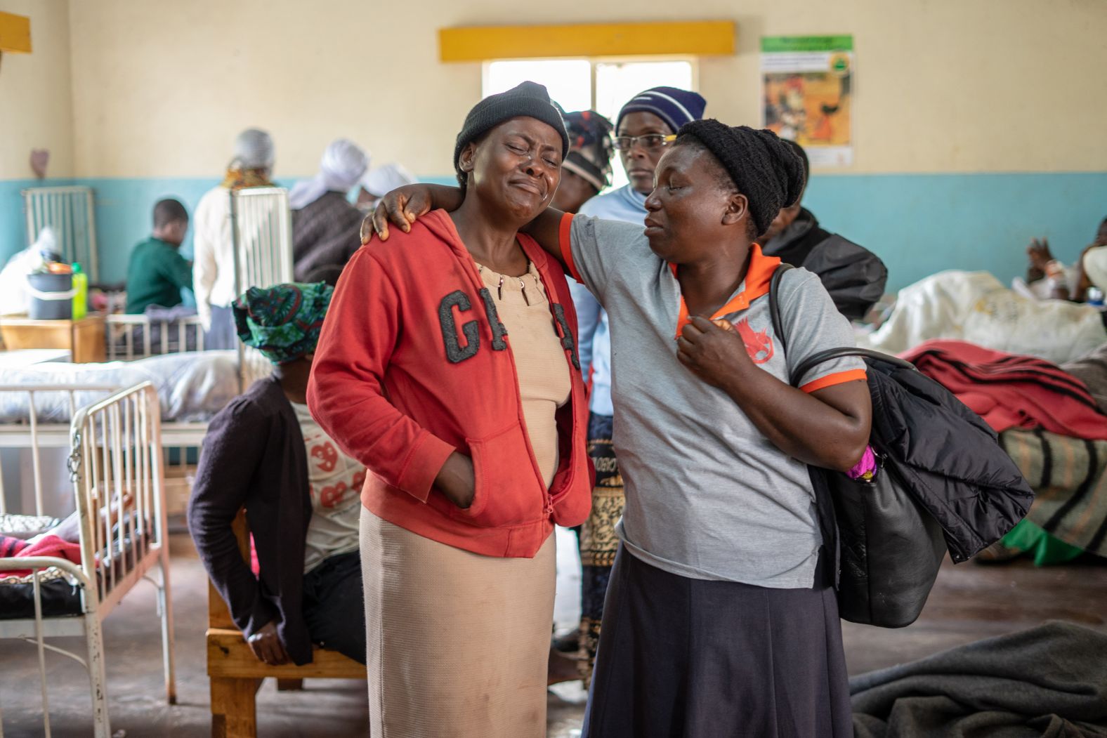 Family members react to a child with broken limbs at the Chimanimani rural district hospital on March 18.