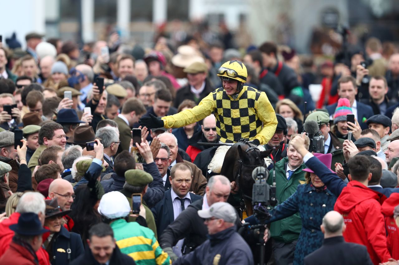 A capacity crowd of nearly 70,000 descended on Prestbury Park in England's Cotswolds for the concluding Gold Cup day of the Festival.  