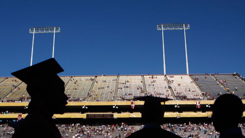 Arizona State University graduate students are silhouetted during their graduation at Sun Devil Stadium May 13, 2009, in Tempe, Arizona.