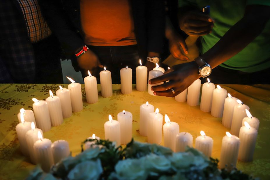 Relatives of Kenyan victims, who were among the 157 passengers and crew killed on the crashed Ethiopian Airlines flight, light candles during a memorial service at the Kenyan Embassy in Addis Ababa, on March 16.