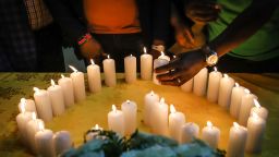 Relatives of Kenyan victims, who perished among the 157 passengers and crew onboard the Ethiopian Airlines operated Boeing 737 MAX 8 aircraft, light candles during a memorial service at the Kenyan Embassy in Addis Ababa, on March 16, 2019. (Photo by Michael TEWELDE / AFP/Getty Images)