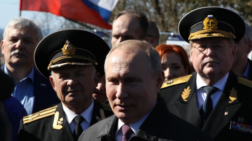 SIMFEROPOL, CRIMEA - MARCH 18: (RUSSIA OUT)Russian President Vladimir Putin (C) greets WWII veteran at  the monument at Malakhov Hill, March 18, 2019 in Simferopol, Crimea, Russia. Putin is having a one-day visit to Crimea, a disputed territory, marking the 5th anniversary of its annexation. (Photo by Mikhail Svetlov/Getty Images)