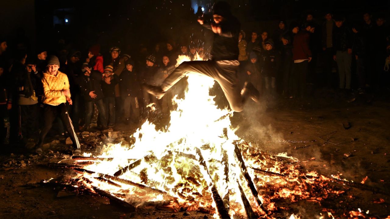 <strong>Nowruz (Persian New Year). </strong>Cultures and countries around the world mark spring equinox with various holidays, including Nowruz. Revelers jump over a bonfire during Nowruz celebrations in Baku, Azerbaijan, in 2018. Click through the gallery for more photos of celebrations tied to spring equinox: