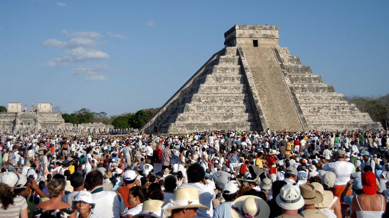 <strong>Chichen Itza.</strong> This complex of Mayan ruins on the Yucatan Peninsula of Mexico is popular all year but especially during the spring and autumn equinoxes. Here, thousands of tourists surround the Kukulcan Pyramid on March 21, 2006.