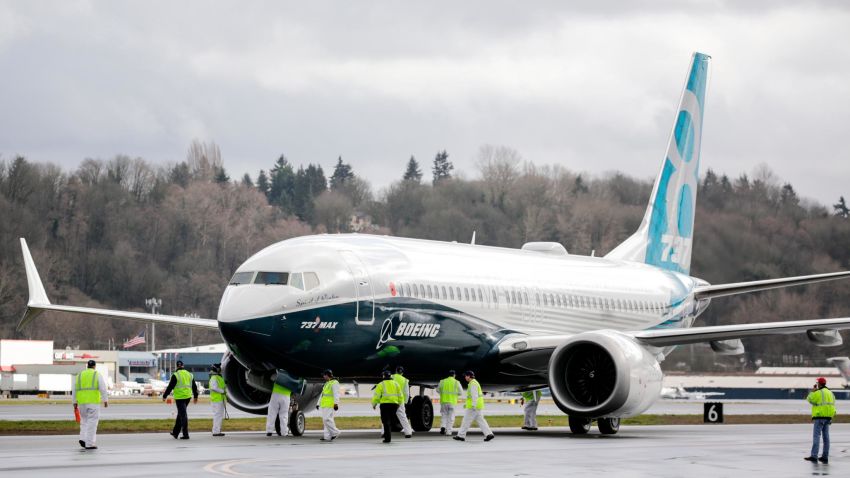 SEATTLE, WA - JANUARY 29: Members of the ground crew check out a Boeing 737 MAX 8 airliner after it landed at Boeing Field to complete its first flight on January 29, 2016 in Seattle, Washington. The 737 MAX is the newest generation of Boeing's most popular airliner featuring more fuel efficient engines and redesigned wings. (Photo by Stephen Brashear/Getty Images)