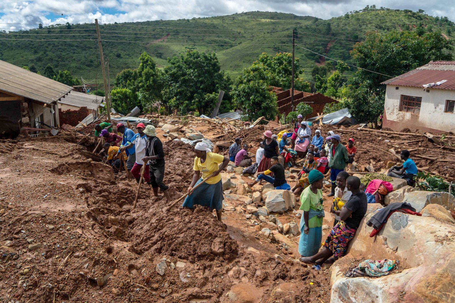 Residents search for bodies on March 19 in the Ngangu township of Chimanimani.