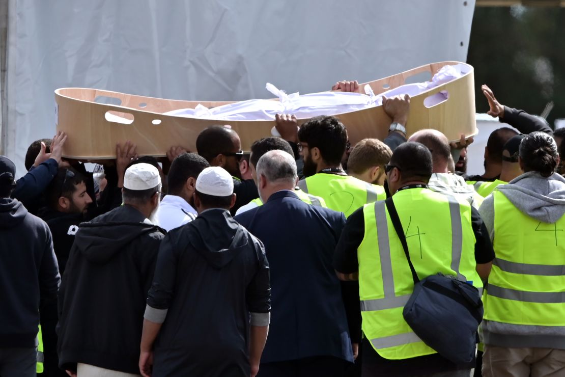 Mourners carry the coffin of a victim killed in the attack.