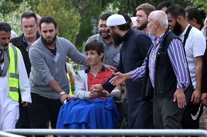 Zaid Mustafa (in wheelchair), who was wounded in the attack on two mosques in Christchurch, New Zealand, <a href="index.php?page=&url=https%3A%2F%2Fwww.cnn.com%2F2019%2F03%2F20%2Faustralia%2Fnew-zealand-victims-funerals-christchurch-intl%2Findex.html" target="_blank">attends the funeral</a> of his slain father, Khalid Mustafa and brother Hamza Mustafa at the Memorial Park Cemetery in Christchurch on March 20.
