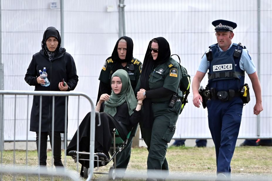 A mourner in a wheelchair leaves Memorial Park Cemetery on March 20 after attending a funeral for victims killed in the mosque massacre in Christchurch, New Zealand. A Syrian refugee and his son were buried in the first funerals for those killed in the attack as New Zealanders braced for days of emotional farewells following the mass slayings.