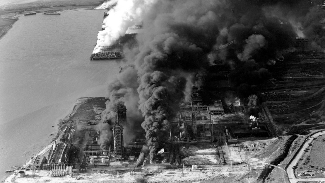 Refineries and oil storage tanks from the Monsanto chemical plant burn along the waterfront in Texas City, Texas, on April 16, 1947. 