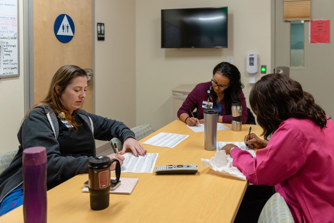 Nurses at the emergency psychiatric unit in San Pedro, known as the Outpatient Behavioral Health Center, discuss the status of patients at the facility.