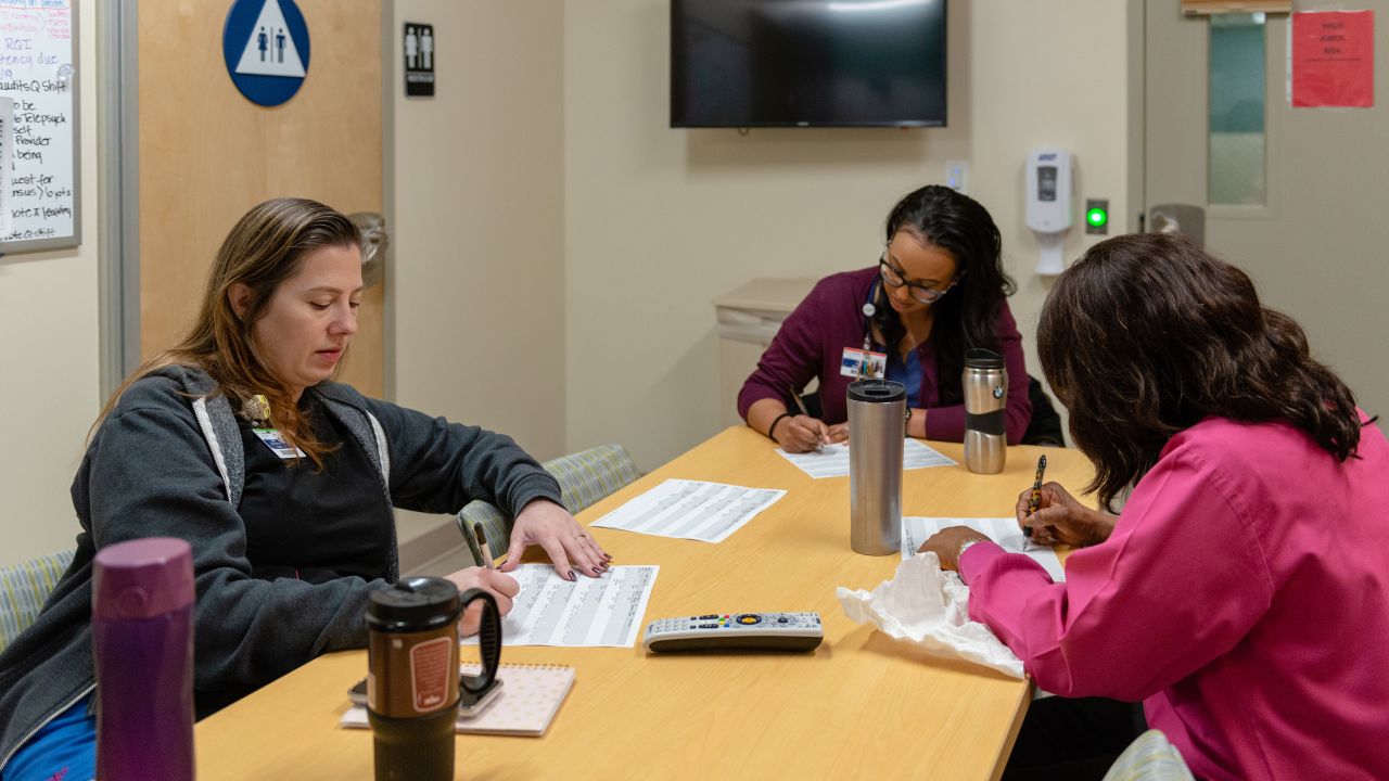 Nurses at the emergency psychiatric unit in San Pedro, known as the Outpatient Behavioral Health Center, discuss the status of patients at the facility.