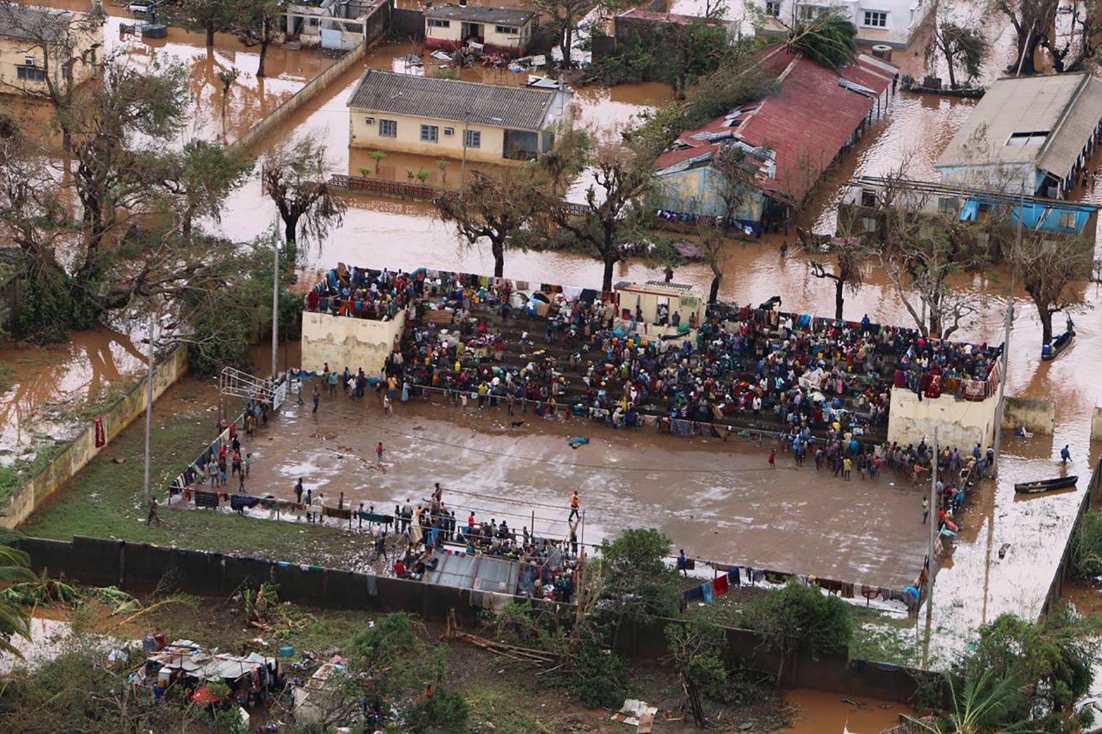 Residents stranded on the stands of a stadium in a flooded area of Buzi, Mozambique, on March 20.