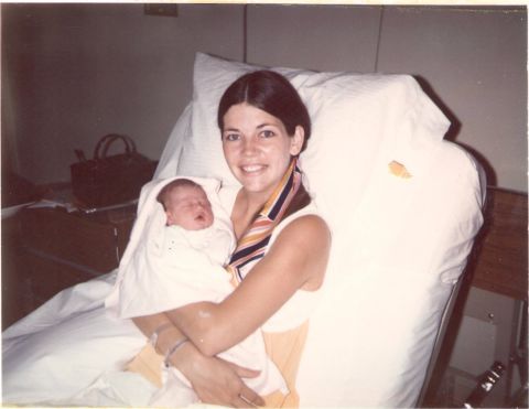 Warren holds her newborn daughter, Amelia, in 1971. She and her first husband, Jim Warren, had two children before divorcing in 1980.