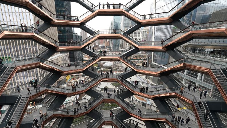 <strong>Hudson Yards, New York:</strong> Visitors take park in the "inaugural walk" up New York's newest landmark, a 150-foot structure, temporarily known as Vessel, designed by Thomas Heatherwick.