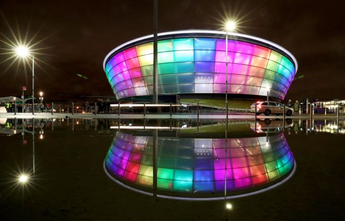 <strong>Glasgow, Scotland. </strong>The SSE Hydro indoor arena on the banks of the River Clyde is illuminated in the rainbow colors for LGBT History Month.