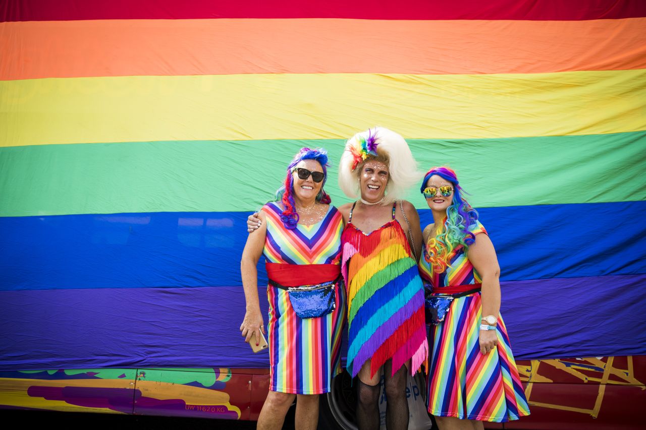<strong>Brighton, England.</strong> Parade-goers match the rainbow flag during Brighton Pride in August 2018.