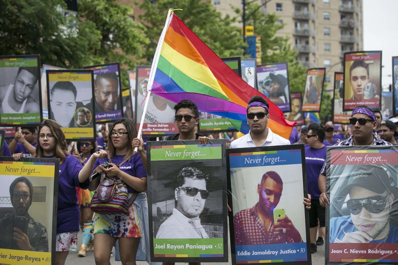 <strong>Chicago, Illinois. </strong>Participants in the 2016 Chicago Pride Parade carry pictures of the victims killed in the Pulse nightclub shooting in Orlando, Florida, which happened less than two weeks before the parade.
