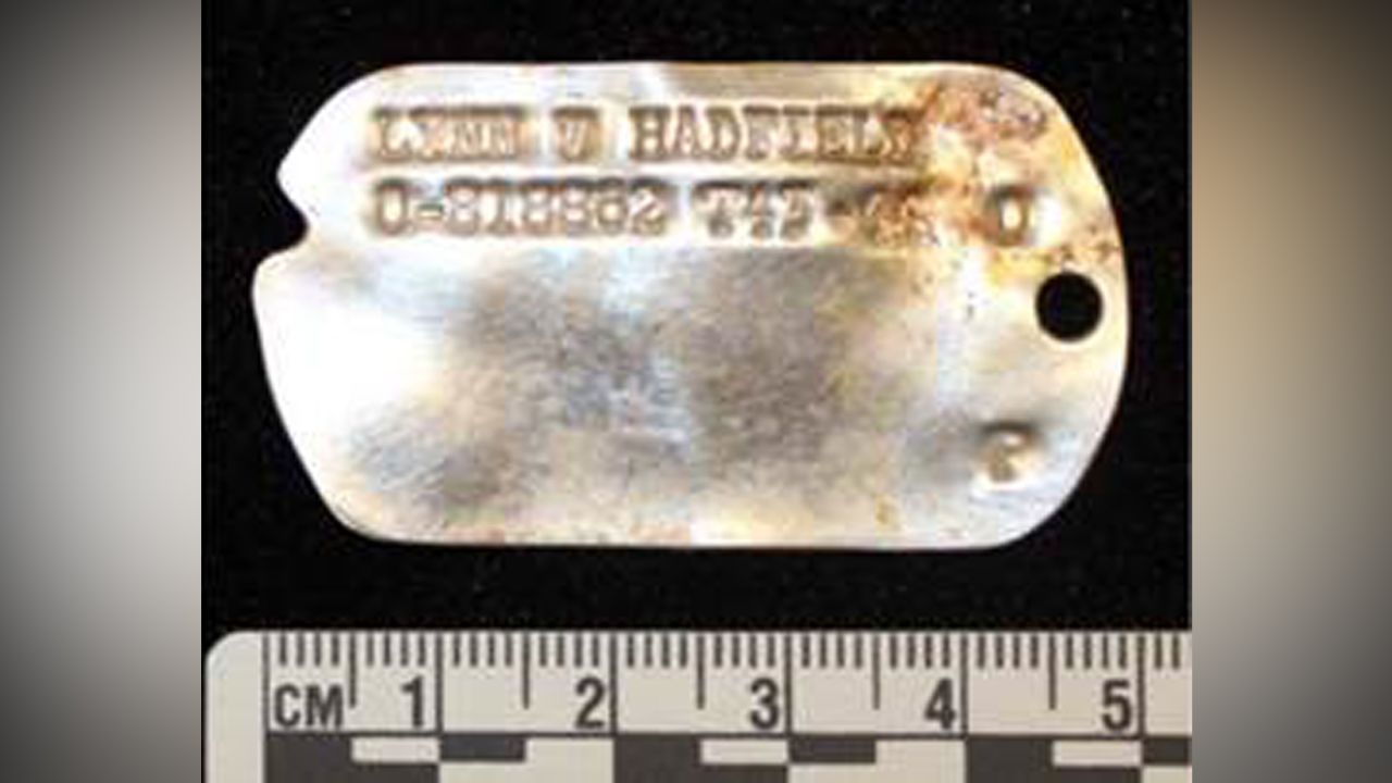 An ID tag was among personal items found by researchers.