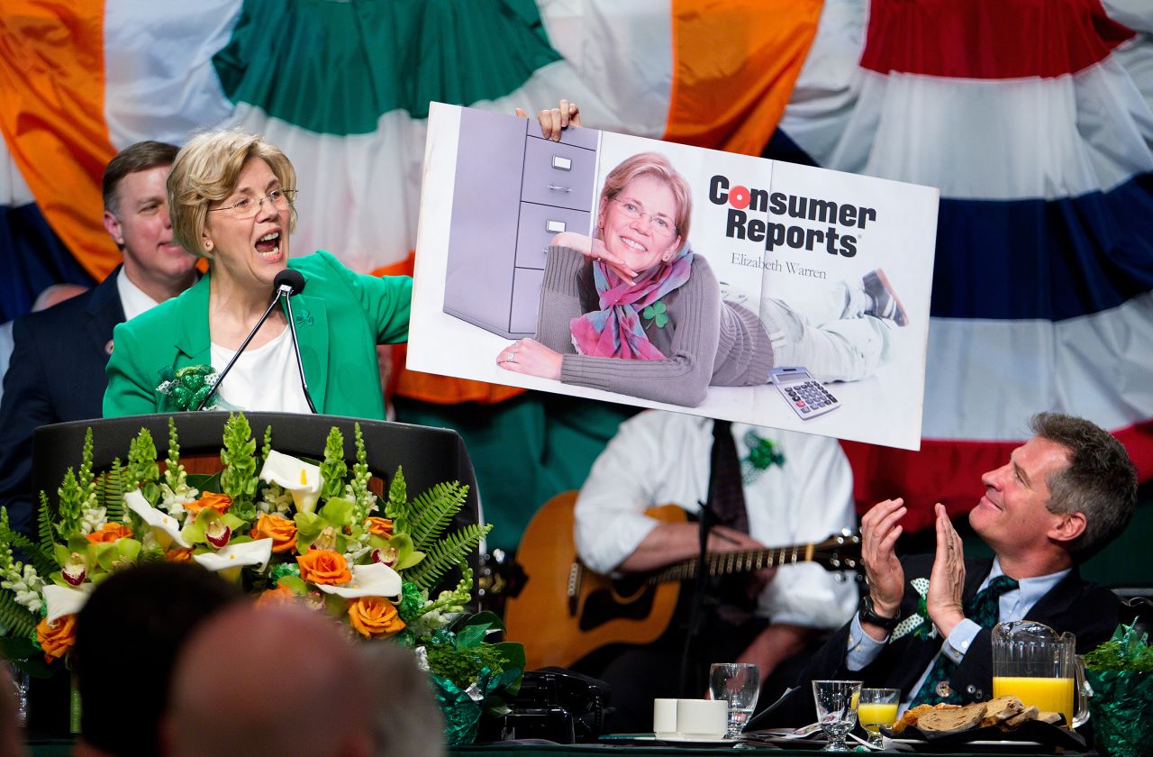 Warren and US Sen. Scott Brown, right, make fun of each other during an annual St. Patrick's Day breakfast in Boston. Warren announced in 2011 that she would be challenging Brown for his Senate seat..