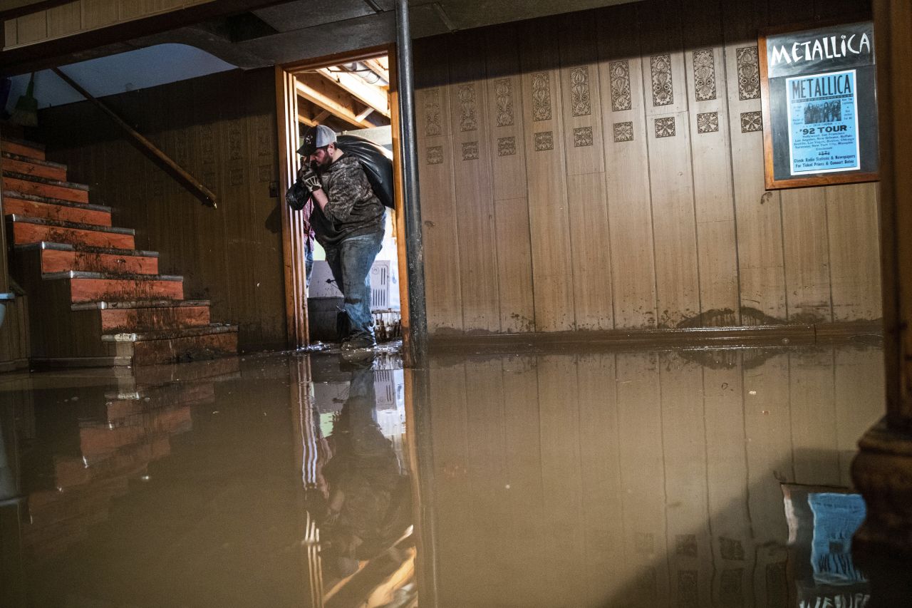 Jake Nebuda removes damaged items from the basement of a home on March 19 in North Bend, Nebraska.