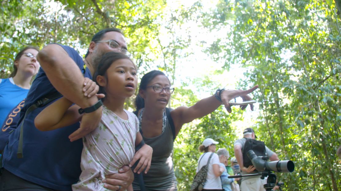 The Bush-Vinje family spots animals like iguanas and butterflies in Manuel Antonio National Park.