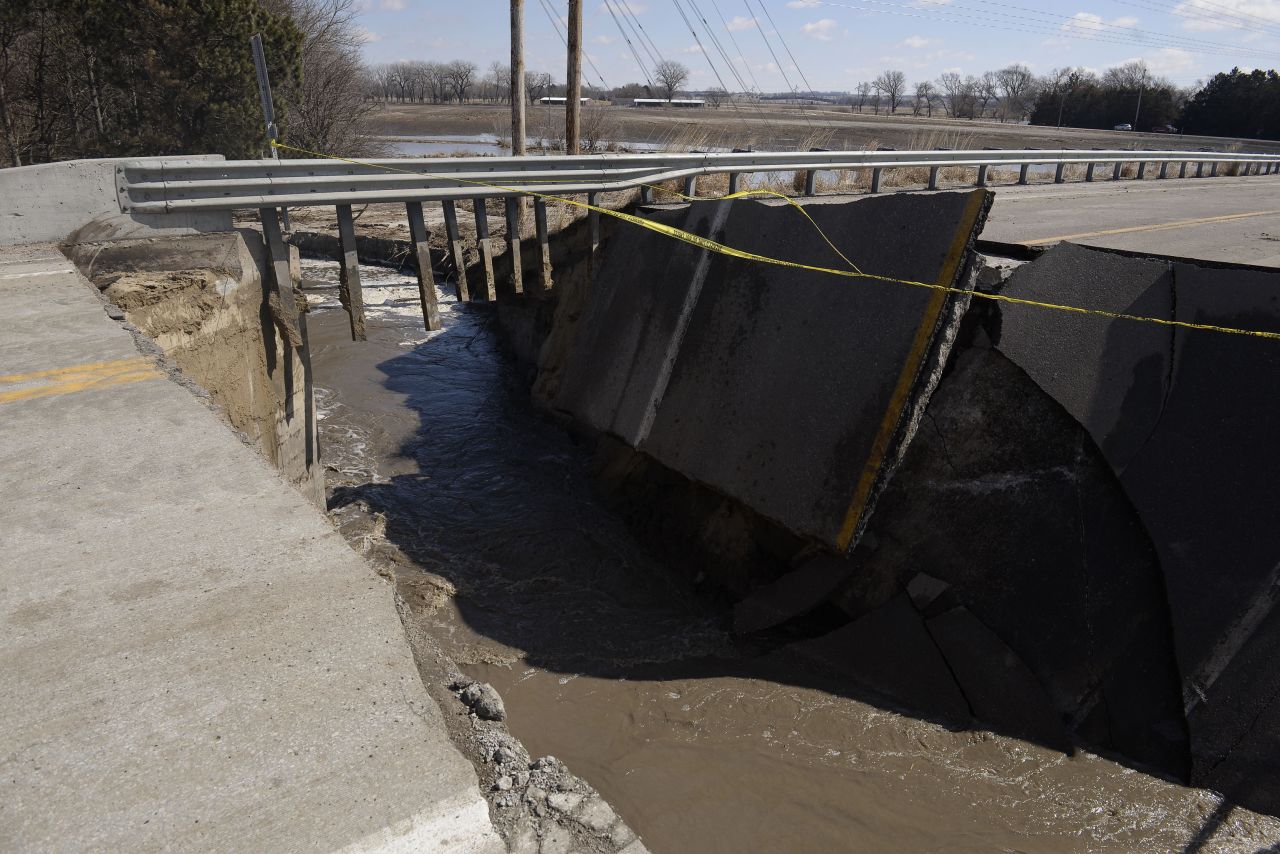 The collapsed approach to a bridge is seen on March 15 over the Elkhorn River, leading south out of Stanton, Nebraska.