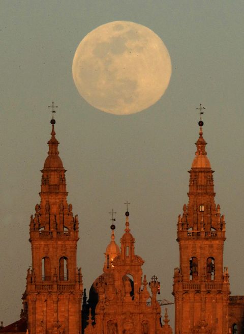 A view of the full moon that announces the start of the spring over the Santiago de Compostela Cathedral in Galicia, Spain on March 20.