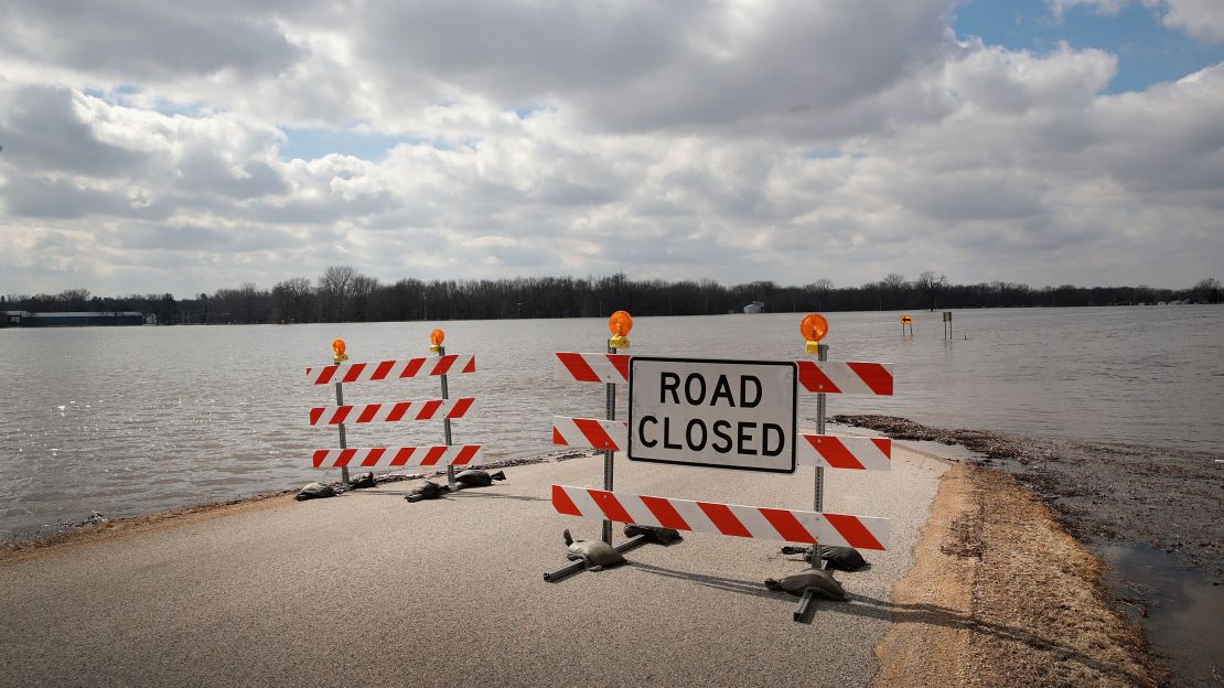 A road is covered with floodwater in Freeport, Illinois, during 2019's record floods. Officials in some towns and cities in the Midwest are frightened by what could happen if they are swamped again this year.